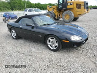 1999 Jaguar XK z VIN SAJGX2044XC031383, wystawiony jako Copart lot #54726925 z przebiegiem 107 696 mil mil oraz Szkody całkowita. Historia ofert i sprzedaży dostępna na DreamBid. Obrazek 4.