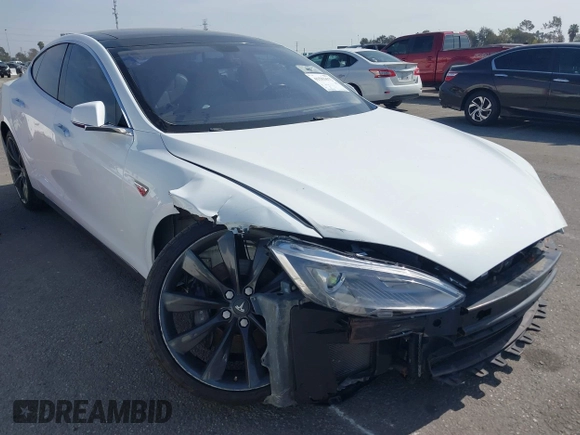 2014 Tesla Model S 60 with VIN 5YJSA1H15EFP46980, listed as a IAAI auction lot 41583672 with 61,080 mi miles and . Bid and sale history available at DreamBid. Image 1.
