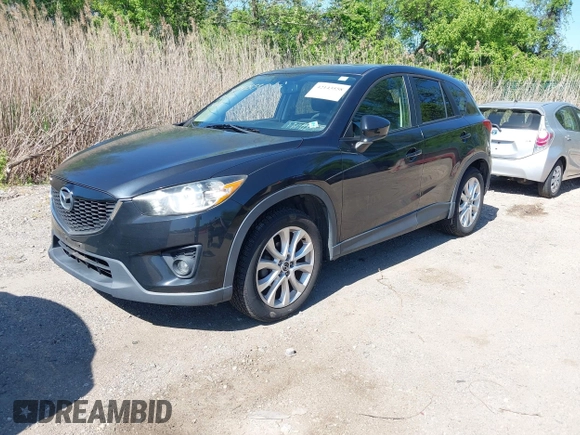 2013 Mazda CX-5 Grand Touring with VIN JM3KE4DE6D0127601, listed as a IAAI auction lot 42143558 with 95,719 mi miles and . Bid and sale history available at DreamBid. Image 2.