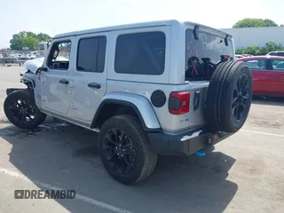 2024 Jeep Wrangler Sahara with VIN 1C4RJXP60RW292136, listed as a IAAI auction lot 42280063 with 26,701 mi miles and . Bid and sale history available at DreamBid. Image 3.