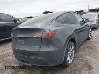 2023 Tesla Model Y Long Range with VIN 7SAYGAEE8PF587202, listed as a IAAI auction lot 41306811 with 1 mi miles. Bid and sale history available at carsss.com. Image 4.