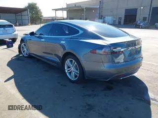 2014 Tesla Model S 60 with VIN 5YJSA1S10EFP32851, listed as a IAAI auction lot 41730746 with 91,657 mi miles and . Bid and sale history available at DreamBid. Image 3.