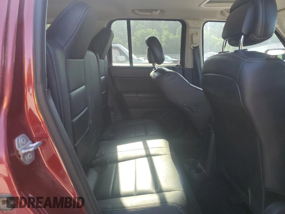 2015 Jeep Patriot High Altitude with VIN 1C4NJRFBXFD272296, listed as a Copart auction lot 62051095 with 118,496 mi miles and Salvage title. Bid and sale history available at DreamBid. Image 11.