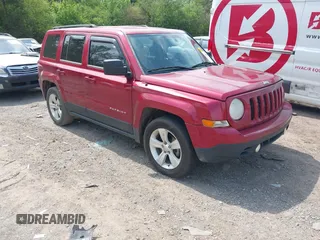 2014 Jeep Patriot Sport with VIN 1C4NJPBBXED617934, listed as a IAAI auction lot 42001839 with 117,306 mi miles. Bid and sale history available at carsss.com. Image 1.
