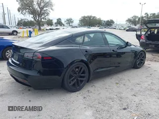 2023 Tesla Model S with VIN 5YJSA1E52PF500088, listed as a IAAI auction lot 41372918 with Not provided miles and . Bid and sale history available at DreamBid. Image 4.