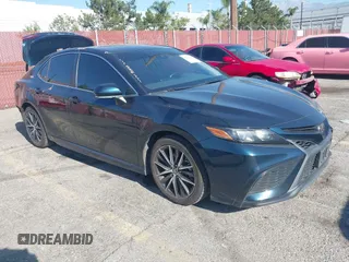 2021 Toyota Camry SE Nightshade with VIN 4T1T11AKXMU430841, listed as a IAAI auction lot 42019485 with 124,561 mi miles. Bid and sale history available at carsss.com. Image 1.