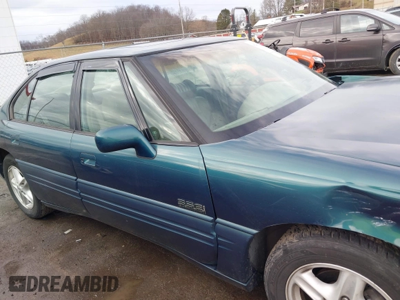 1996 Pontiac Bonneville z VIN 1G2HZ5210TH210829, wystawiony jako IAAI lot #41203888 z przebiegiem 154 990 mil mil oraz . Historia ofert i sprzedaży dostępna na DreamBid. Obrazek 13.