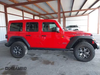 2021 Jeep Wrangler Unlimited Rubicon z VIN 1C4HJXFG8MW785318, wystawiony jako IAAI lot #42118969 z przebiegiem 61 572 mil mil oraz . Historia ofert i sprzedaży dostępna na DreamBid. Obrazek 13.
