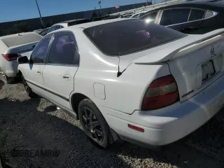 1995 Honda Accord LX with VIN 1HGCD5634SA021951, listed as a Copart auction lot 75093974 with 219,733 mi miles and Salvage Title. Bid and sale history available at carsss.com. Image 2.