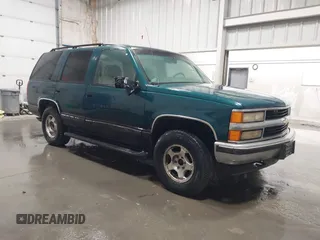 1996 Chevrolet Tahoe z VIN 1GNEK13R4TJ417000, wystawiony jako IAAI lot #41992121 z przebiegiem 166 215 mil mil oraz . Historia ofert i sprzedaży dostępna na DreamBid. Obrazek 1.