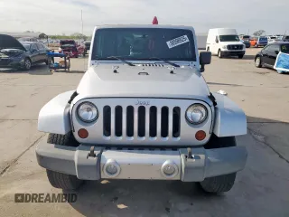 2009 Jeep Wrangler Sahara z VIN 1J4FA54169L780809, wystawiony jako Copart lot #50598925 z przebiegiem 121 078 mil mil oraz Szkoda całkowita • Salvage title. Historia ofert i sprzedaży dostępna na DreamBid. Obrazek 5.