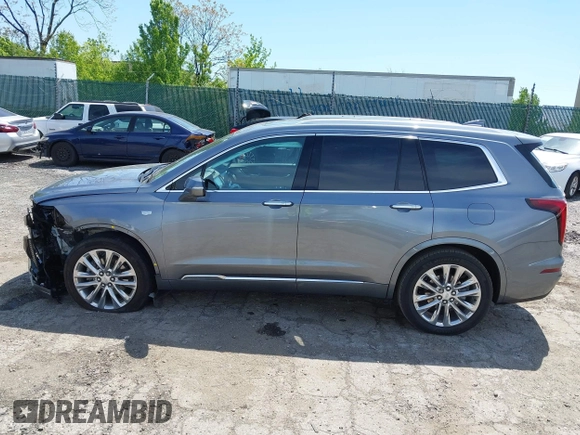 2022 Cadillac XT6 Premium Luxury z VIN 1GYKPDRS4NZ146284, wystawiony jako IAAI lot #42150678 z przebiegiem 28 890 mil mil oraz . Historia ofert i sprzedaży dostępna na DreamBid. Obrazek 15.
