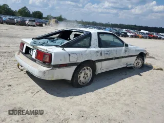 1986 Toyota Supra z VIN JT2MA70L7G0014661, wystawiony jako Copart lot #72161554 z przebiegiem 160 516 mil mil oraz Czysty tytuł • Clean title. Historia ofert i sprzedaży dostępna na DreamBid. Obrazek 3.