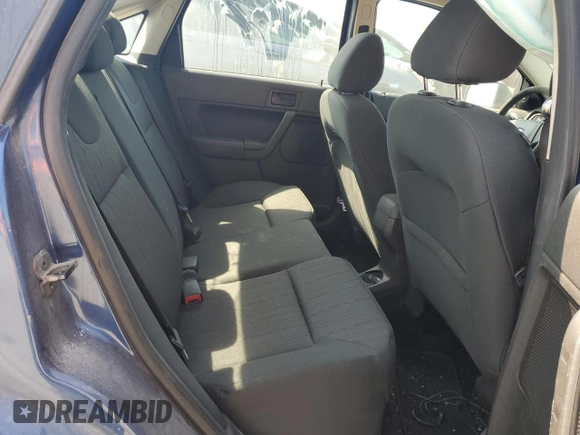 2009 Ford Focus SE with VIN 1FAHP35N69W173977, listed as a Copart auction lot 69018554 with 138,496 mi miles and Salvage Title. Bid and sale history available at DreamBid. Image 10.