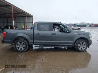 2019 Ford F-150 XL with VIN 1FTEW1C56KKC31025, listed as a IAAI auction lot 41452618 with 153,422 mi miles and . Bid and sale history available at DreamBid. Image 13.