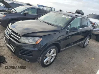 2012 Volkswagen Touareg Exec with VIN WVGEF9BP1CD011407, listed as a Copart auction lot 79199754 with 57,376 mi miles and Salvage Title. Bid and sale history available at DreamBid. Image 1.