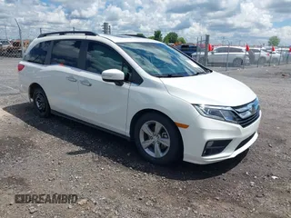 2018 Honda Odyssey EX-L z VIN 5FNRL6H71JB057300, wystawiony jako IAAI lot #42200036 z przebiegiem 96 038 mil mil oraz . Historia ofert i sprzedaży dostępna na DreamBid. Obrazek 1.