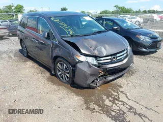 2016 Honda Odyssey Touring Elite with VIN 5FNRL5H92GB075521, listed as a IAAI auction lot 42529136 with 82,521 mi miles and . Bid and sale history available at DreamBid. Image 1.