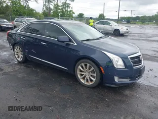 2016 Cadillac XTS Luxury Collection z VIN 2G61M5S38G9145982, wystawiony jako IAAI lot #42248183 z przebiegiem 100 420 mil mil oraz . Historia ofert i sprzedaży dostępna na DreamBid. Obrazek 1.