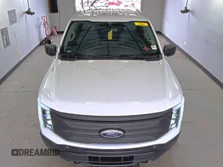 2022 Ford F-150 Lightning Pro with VIN 1FTVW1EL5NWG11725, listed as a IAAI auction lot 42832825 with 5,044 mi miles and . Bid and sale history available at DreamBid. Image 13.