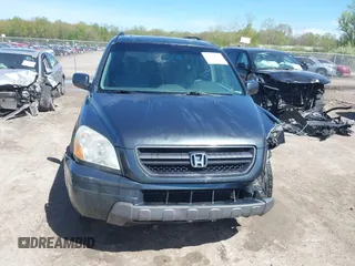 2005 Honda Pilot EX-L with VIN 2HKYF18625H515771, listed as a IAAI auction lot 42152527 with 293,380 mi miles and . Bid and sale history available at DreamBid. Image 12.