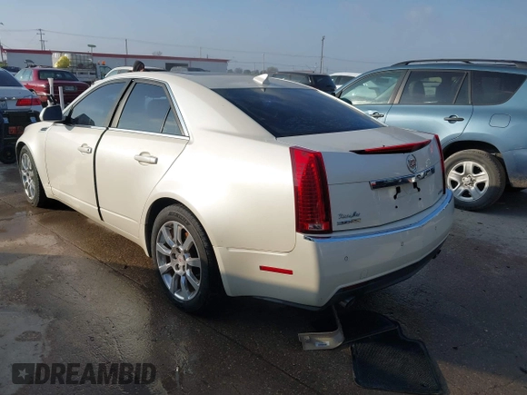 2009 Cadillac CTS AWD z VIN 1G6DT57VX90140080, wystawiony jako IAAI lot #41802817 z przebiegiem 146 978 mil mil oraz . Historia ofert i sprzedaży dostępna na DreamBid. Obrazek 3.