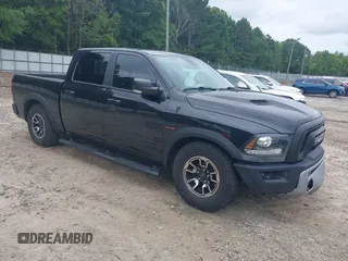 2017 Ram 1500 Rebel with VIN 1C6RR7YT9HS539938, listed as a IAAI auction lot 42469340 with 98,416 mi miles and . Bid and sale history available at DreamBid. Image 1.