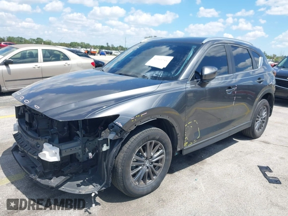 2020 Mazda CX-5 Touring with VIN JM3KFACM9L0826742, listed as a IAAI auction lot 41903755 with 73,409 mi miles and . Bid and sale history available at DreamBid. Image 6.