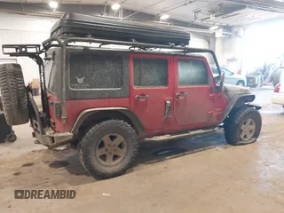 2011 Jeep Wrangler Unlimited Sport with VIN 1J4HA3H1XBL534312, listed as a IAAI auction lot 41030703 with 1 mi miles. Bid and sale history available at carsss.com. Image 4.