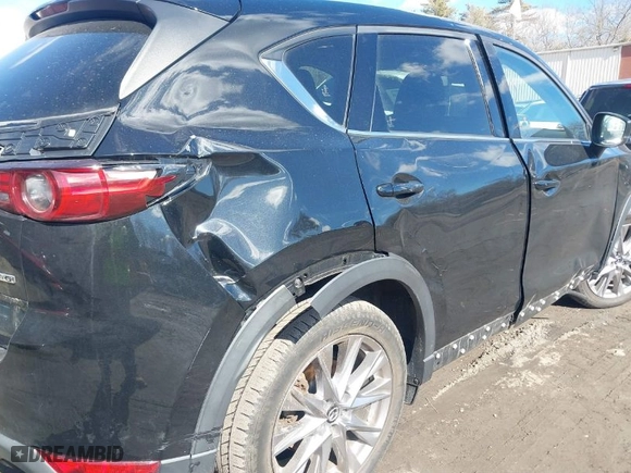 2021 Mazda CX-5 Grand Touring with VIN JM3KFBDM3M1318248, listed as a IAAI auction lot 41678260 with 71,903 mi miles. Bid and sale history available at carsss.com. Image 6.