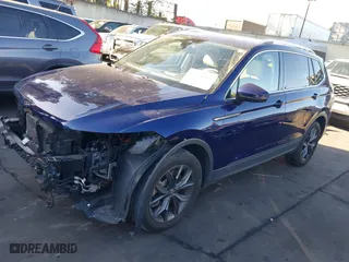 2022 Volkswagen Tiguan SE with VIN 3VV3B7AX5NM128462, listed as a IAAI auction lot 41668066 with 25,113 mi miles. Bid and sale history available at carsss.com. Image 2.