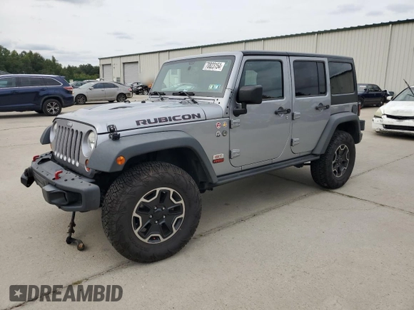2013 Jeep Wrangler Unlimited Rubicon 10th Anniversary z VIN 1C4HJWFG3DL703331, wystawiony jako Copart lot #70823154 z przebiegiem 148 860 mil mil oraz Szkoda całkowita • Salvage title. Historia ofert i sprzedaży dostępna na DreamBid. Obrazek 1.