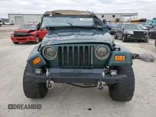 2000 Jeep Wrangler Sahara z VIN 1J4FA59S5YP803327, wystawiony jako Copart lot #44382505 z przebiegiem Nie podano mil oraz Szkoda całkowita • Salvage title. Historia ofert i sprzedaży dostępna na DreamBid. Obrazek 5.