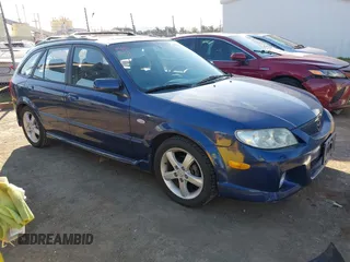 2003 Mazda Protege with VIN JM1BJ246831151148, listed as a IAAI auction lot 41472821 with 247,589 mi miles and . Bid and sale history available at DreamBid. Image 1.