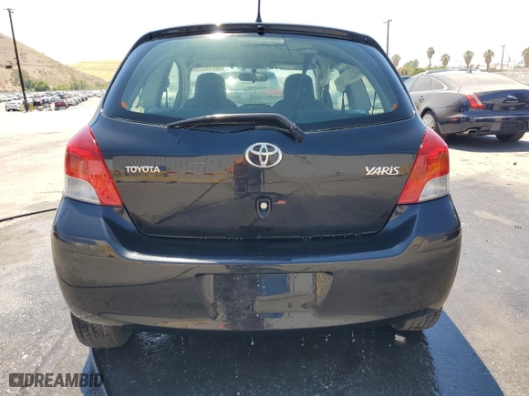 2010 Toyota Yaris with VIN JTDJT4K38A5293533, listed as a Copart auction lot 61105754 with 85,952 mi miles and Salvage Title. Bid and sale history available at carsss.com. Image 6.