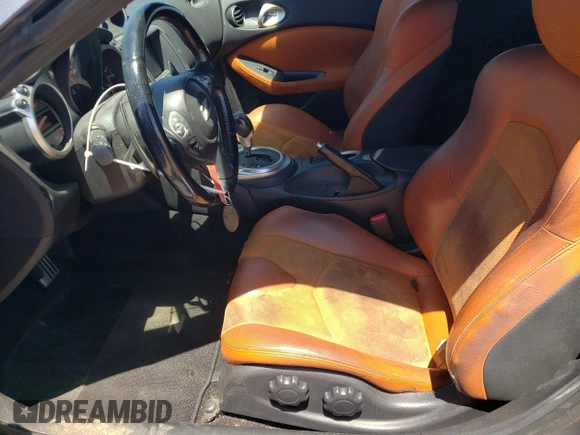 2014 Nissan 370Z Nismo with VIN JN1AZ4EH7EM633324, listed as a Copart auction lot 53812335 with 57,856 mi miles and Salvage Title. Bid and sale history available at DreamBid. Image 7.