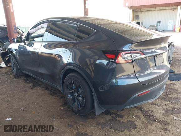 2024 Tesla Model Y with VIN 7SAYGDED9RF053203, listed as a IAAI auction lot 41906729 with Not Provided miles and . Bid and sale history available at DreamBid. Image 3.
