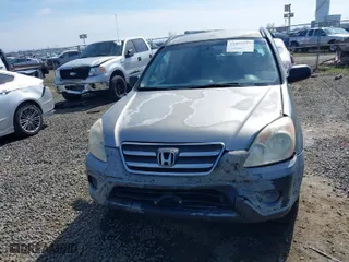 2006 Honda CR-V LX with VIN JHLRD68516C006561, listed as a IAAI auction lot 41855457 with 215,139 mi miles. Bid and sale history available at carsss.com. Image 12.