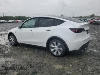 2024 Tesla Model Y Long Range z VIN 7SAYGDEE3RA283311, wystawiony jako Copart lot #56925505 z przebiegiem Nie podano mil oraz Szkoda całkowita • Salvage title. Historia ofert i sprzedaży dostępna na DreamBid. Obrazek 2.