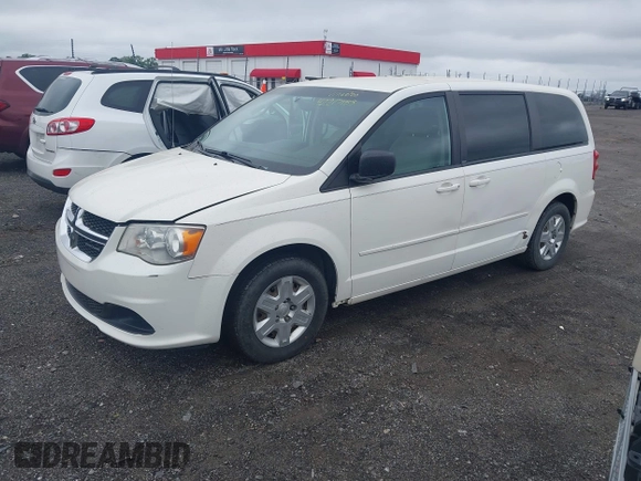 2012 Dodge Grand Caravan SE with VIN 2C4RDGBG8CR115003, listed as a IAAI auction lot 42217153 with 196,833 mi miles and . Bid and sale history available at DreamBid. Image 2.