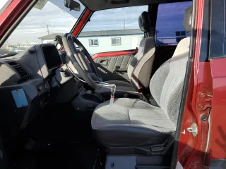 1995 Suzuki Sidekick z VIN JS3TD03V6S4113425, wystawiony jako Copart lot #76973244 z przebiegiem 152 638 mil mil oraz Szkody całkowita. Historia ofert i sprzedaży dostępna na DreamBid. Obrazek 7.