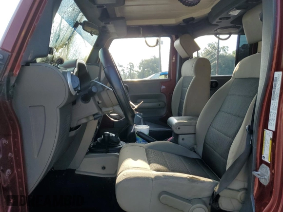 2010 Jeep Wrangler Unlimited Sahara with VIN 1J4BA5H13AL141851, listed as a Copart auction lot 63486504 with 0 mi miles and Salvage Title. Bid and sale history available at carsss.com. Image 7.