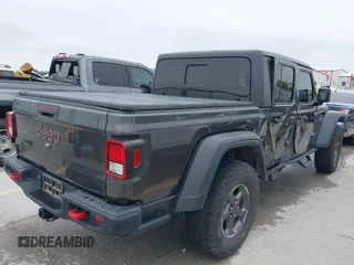 2020 Jeep Gladiator Rubicon with VIN 1C6JJTBG8LL135573, listed as a IAAI auction lot 41585896 with 79,070 mi miles and . Bid and sale history available at DreamBid. Image 4.