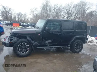 2015 Jeep Wrangler Unlimited Rubicon Hard Rock with VIN 1C4HJWFG9FL569962, listed as a IAAI auction lot 41557801 with 78,597 mi miles and . Bid and sale history available at DreamBid. Image 14.