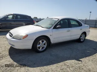 2000 Ford Taurus LX with VIN 1FAFP5222YA168638, listed as a Copart auction lot 60710415 with 119,948 mi miles and Salvage title. Bid and sale history available at DreamBid. Image 1.