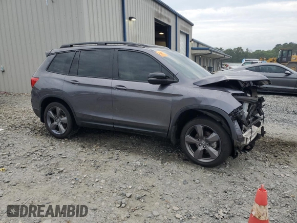 2021 Honda Passport Touring z VIN 5FNYF7H94MB005741, wystawiony jako Copart lot #57626664 z przebiegiem Nie podano mil oraz Szkoda całkowita • Salvage title. Historia ofert i sprzedaży dostępna na DreamBid. Obrazek 4.