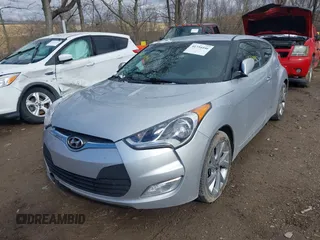 2017 Hyundai Veloster with VIN KMHTC6AD6HU310694, listed as a IAAI auction lot 41734446 with 99,432 mi miles. Bid and sale history available at carsss.com. Image 2.