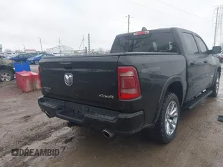 2021 Ram 1500 Laramie with VIN 1C6SRFJT6MN580803, listed as a IAAI auction lot 41207914 with 56,891 mi miles and . Bid and sale history available at DreamBid. Image 4.