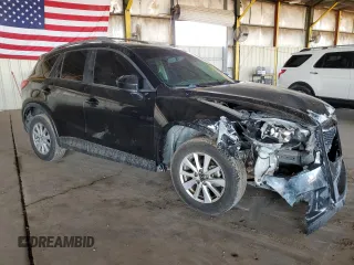 2014 Mazda CX-5 Touring with VIN JM3KE2CY4E0379574, listed as a Copart auction lot 48509655 with 178,102 mi miles and Salvage Title. Bid and sale history available at DreamBid. Image 4.