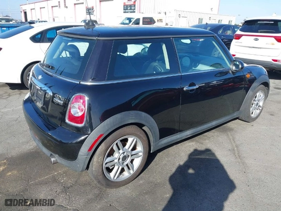 2011 MINI Cooper Hardtop with VIN WMWSU3C56BT093420, listed as a IAAI auction lot 41704260 with 142,408 mi miles. Bid and sale history available at carsss.com. Image 4.